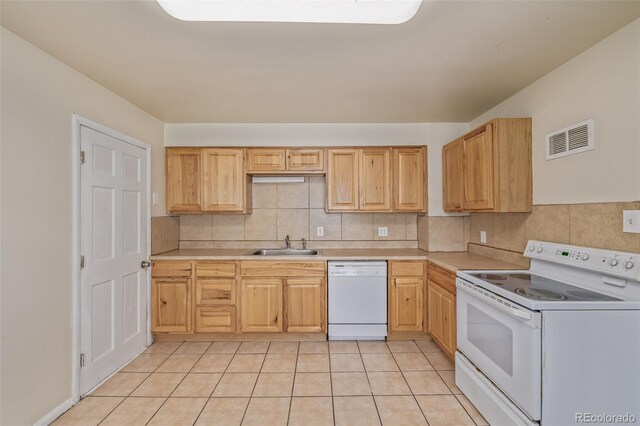 907 4th Ave And B, Unit A, Greeley, CO 80631 - kitchen featuring visible vents, a sink, white appliances, and light countertops