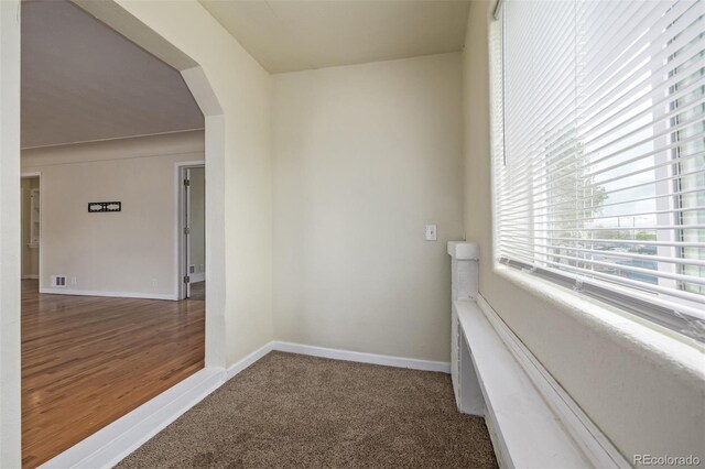 907 4th Ave And B, Unit A, Greeley, CO 80631 - corridor with baseboards, arched walkways, carpet floors, and visible vents