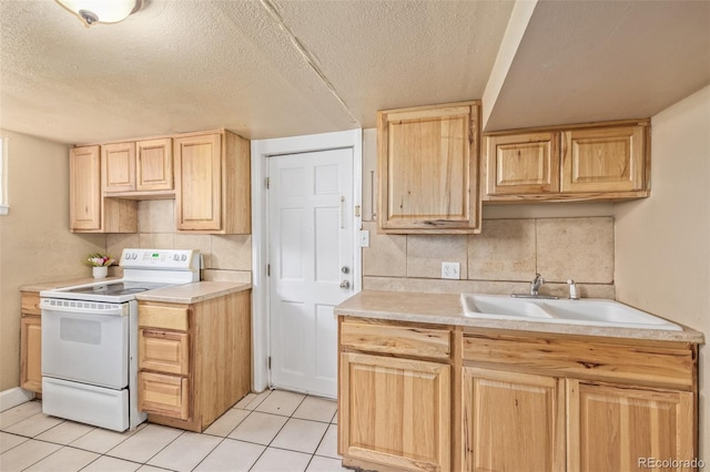 kitchen featuring a textured ceiling, a sink, light brown cabinets, white electric range oven, and light tile patterned flooring