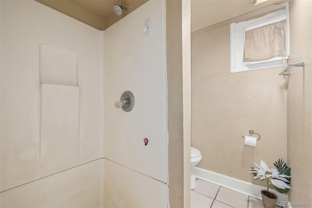 907 4th Ave And B, Unit A, Greeley, CO 80631 - bathroom featuring toilet, tile patterned floors, walk in shower, and baseboards