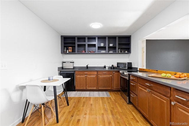 kitchen featuring brown cabinets, dark countertops, appliances with stainless steel finishes, and open shelves