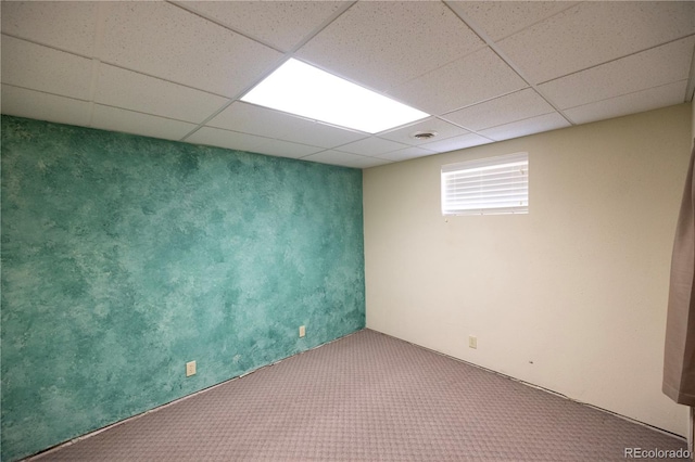 112 8th St, Hugo, CO 80821 - below grade area featuring carpet and a paneled ceiling