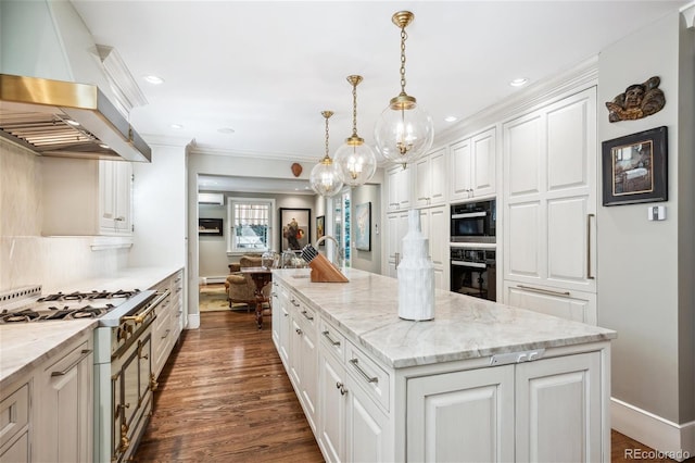 kitchen with a center island, decorative light fixtures, stainless steel range with gas stovetop, white cabinetry, and island range hood