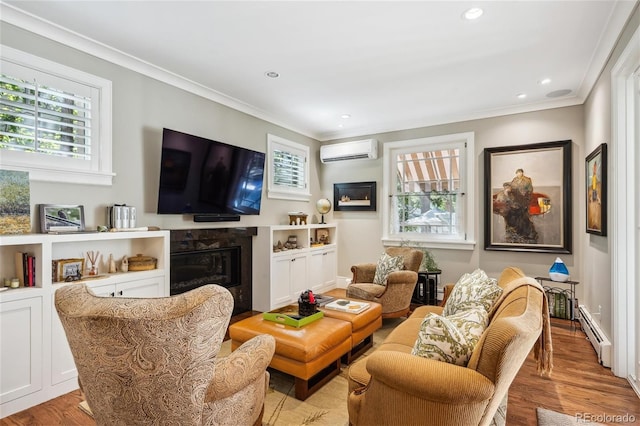 living area with a wealth of natural light, an AC wall unit, baseboard heating, and a premium fireplace