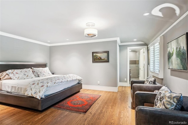 bedroom featuring light wood-type flooring, crown molding, baseboards, and recessed lighting