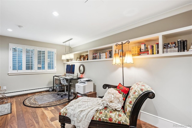 home office featuring a baseboard heating unit, recessed lighting, and wood finished floors