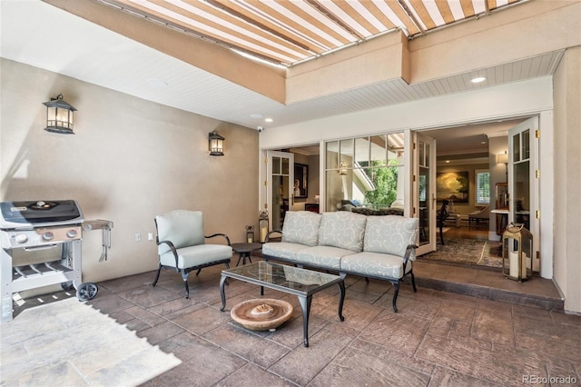 view of patio with an outdoor hangout area and a grill