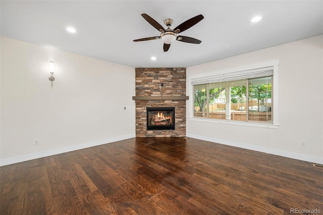 5372 W 68th Ave, Arvada, CO 80003 - unfurnished living room with wood finished floors, a ceiling fan, baseboards, a stone fireplace, and recessed lighting