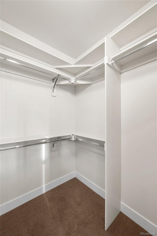 5372 W 68th Ave, Arvada, CO 80003 - spacious closet featuring dark colored carpet