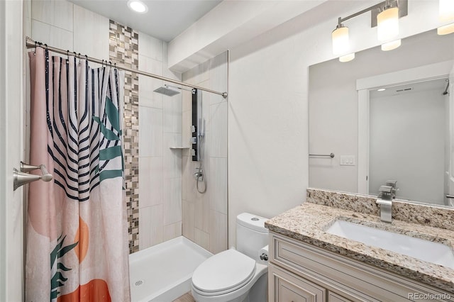 5372 W 68th Ave, Arvada, CO 80003 - bathroom featuring vanity, toilet, a shower stall, and recessed lighting