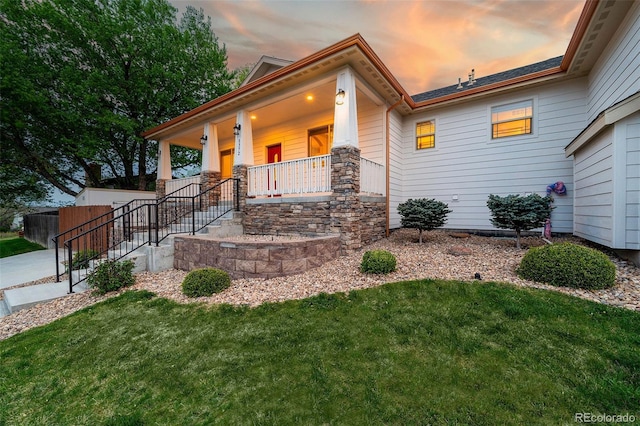 5372 W 68th Ave, Arvada, CO 80003 - view of front facade with a yard and a porch