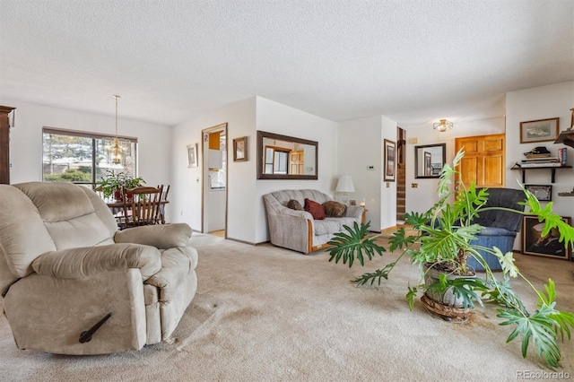 living area with light colored carpet and a textured ceiling