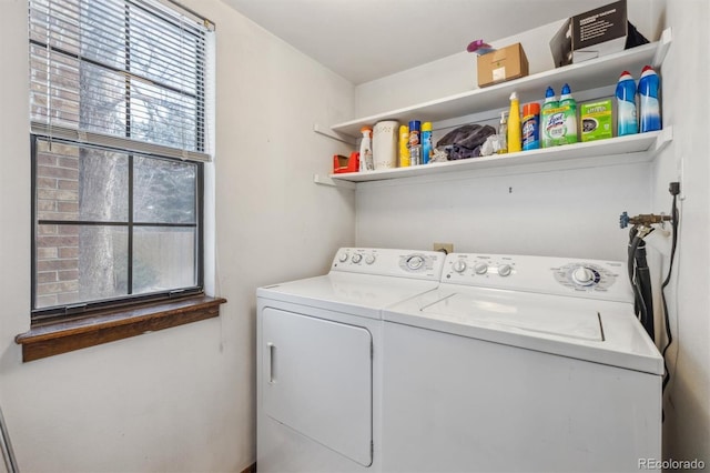 clothes washing area with laundry area and washer and dryer