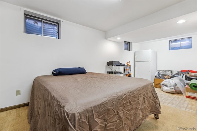 bedroom with freestanding refrigerator, baseboards, and recessed lighting