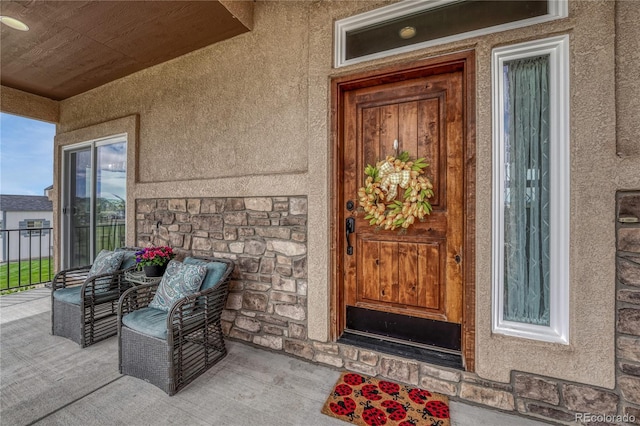 16256 Ridge Run Dr, Colorado Springs, CO 80908 - doorway to property featuring stone siding and stucco siding