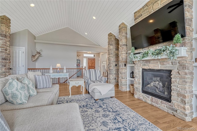 16256 Ridge Run Dr, Colorado Springs, CO 80908 - living room featuring wood ceiling, vaulted ceiling, wood finished floors, a fireplace, and recessed lighting
