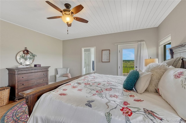 16256 Ridge Run Dr, Colorado Springs, CO 80908 - bedroom with access to outside, wood finished floors, and ceiling fan