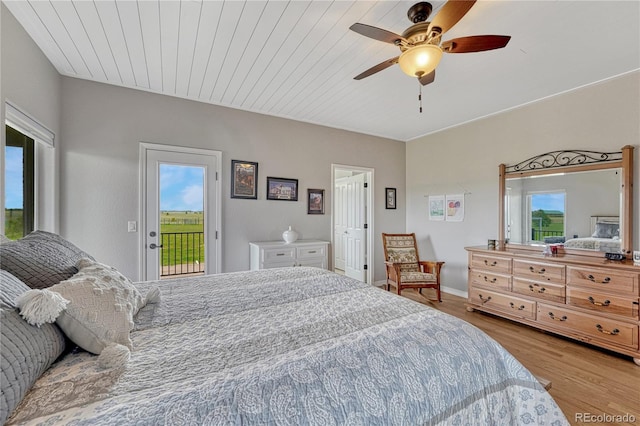 16256 Ridge Run Dr, Colorado Springs, CO 80908 - bedroom with access to outside, multiple windows, wood finished floors, a ceiling fan, and wood ceiling