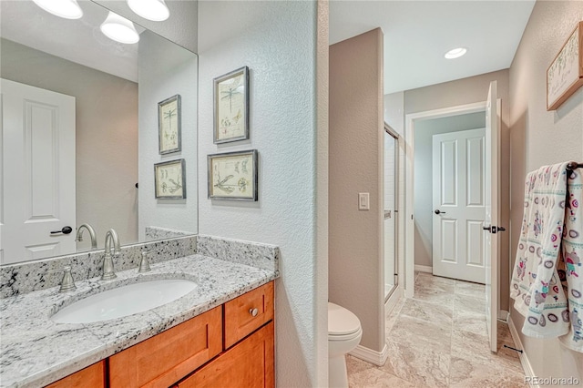16256 Ridge Run Dr, Colorado Springs, CO 80908 - full bathroom featuring toilet, a stall shower, baseboards, a textured wall, and vanity