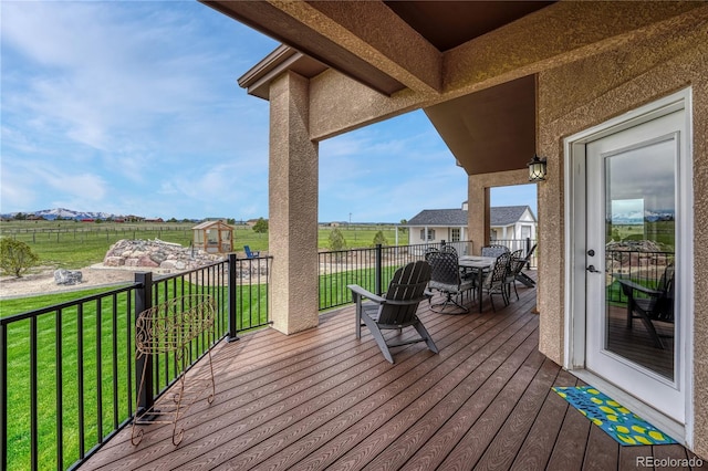 16256 Ridge Run Dr, Colorado Springs, CO 80908 - deck with outdoor dining space and a lawn