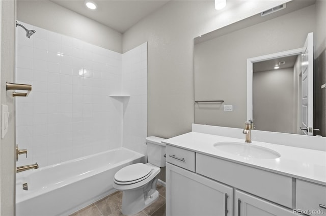 bathroom featuring vanity, toilet, tub / shower combination, and visible vents