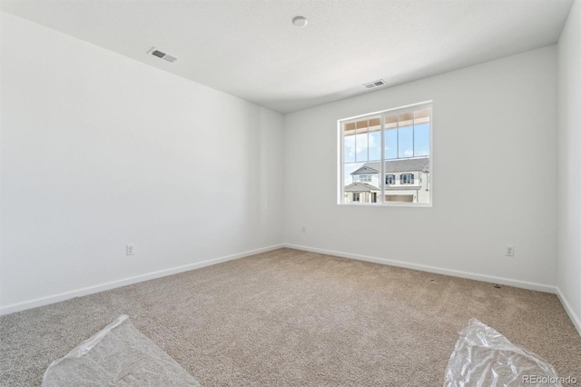 9082 Telluride Ct, Commerce City, CO 80022 - carpeted spare room with visible vents and baseboards