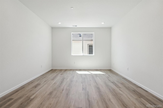 9082 Telluride Ct, Commerce City, CO 80022 - empty room featuring baseboards, light wood-style flooring, and recessed lighting