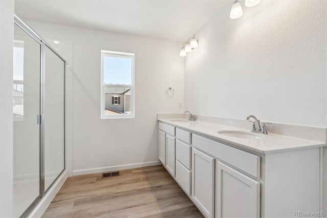 9082 Telluride Ct, Commerce City, CO 80022 - full bathroom with a stall shower, visible vents, and a sink