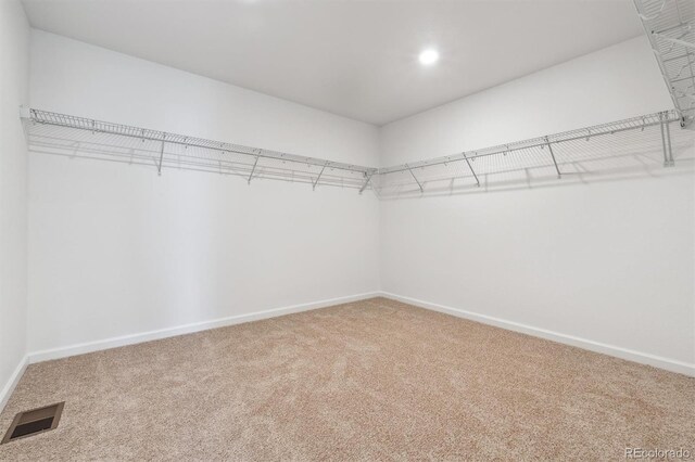 9082 Telluride Ct, Commerce City, CO 80022 - walk in closet featuring carpet flooring and visible vents