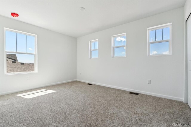 9082 Telluride Ct, Commerce City, CO 80022 - empty room with visible vents, baseboards, and carpet floors
