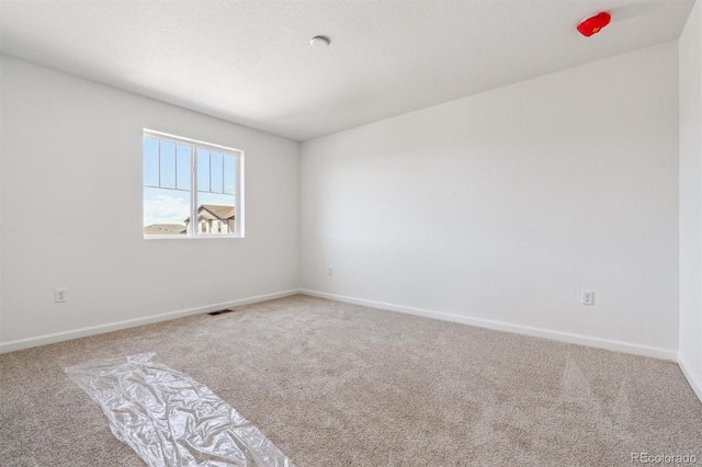 9082 Telluride Ct, Commerce City, CO 80022 - carpeted spare room with baseboards and visible vents