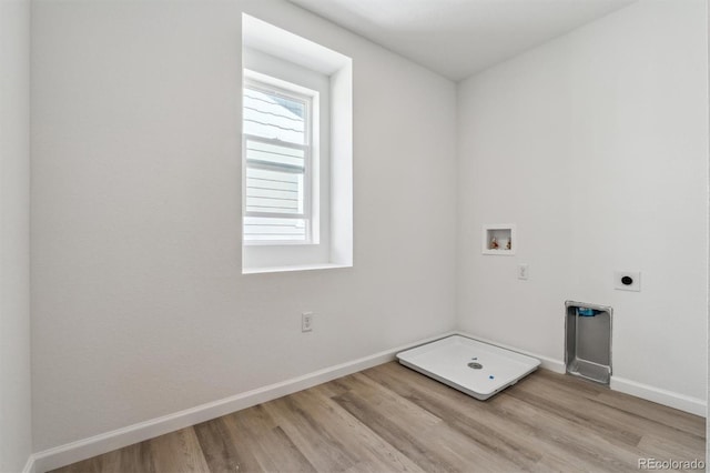 9082 Telluride Ct, Commerce City, CO 80022 - laundry room with laundry area, hookup for an electric dryer, light wood-style flooring, washer hookup, and baseboards