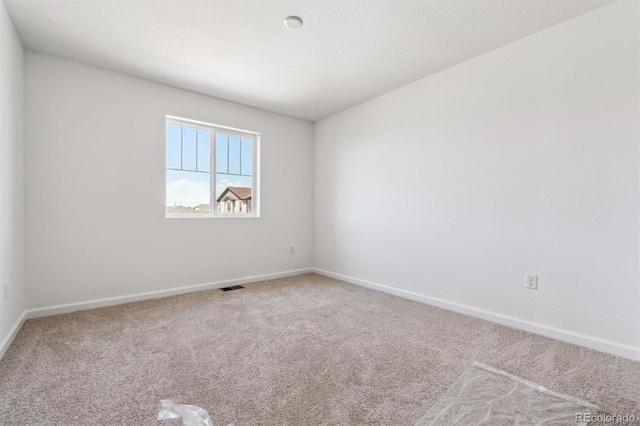 9082 Telluride Ct, Commerce City, CO 80022 - spare room with carpet, visible vents, and baseboards
