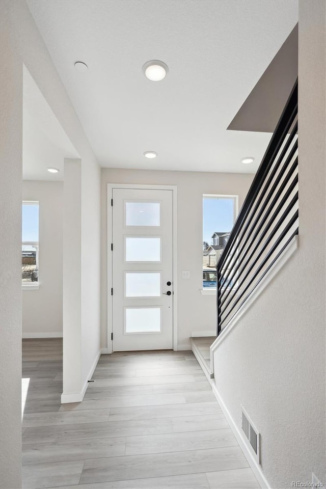 foyer entrance featuring light hardwood / wood-style flooring