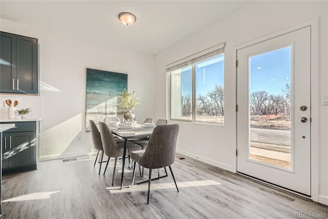 15336 W 68th Loop, Arvada, CO 80007 - dining space with light wood-type flooring and baseboards