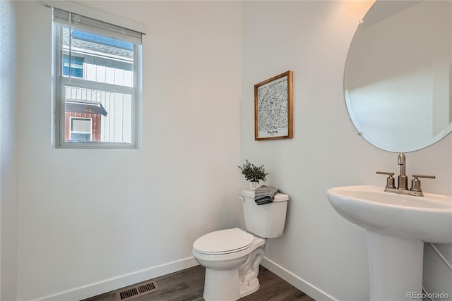 15336 W 68th Loop, Arvada, CO 80007 - half bathroom featuring toilet and wood finished floors