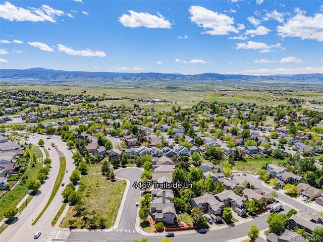 4467 Trailside Ln, Castle Rock, CO 80109 - aerial perspective of suburban area with a mountainous background