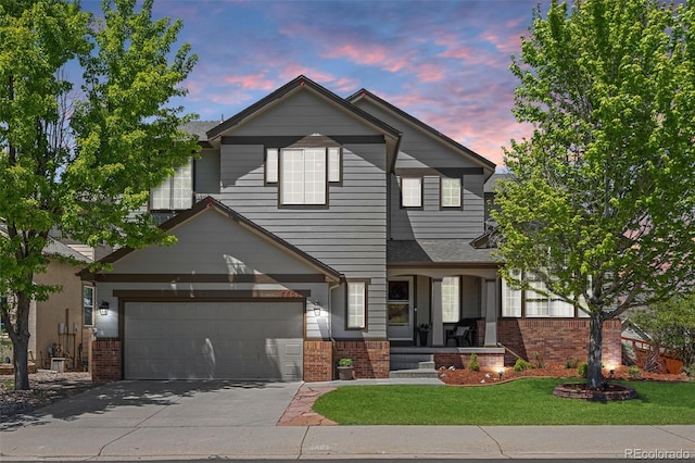 4467 Trailside Ln, Castle Rock, CO 80109 - view of front of house featuring a porch, brick siding, concrete driveway, and a yard