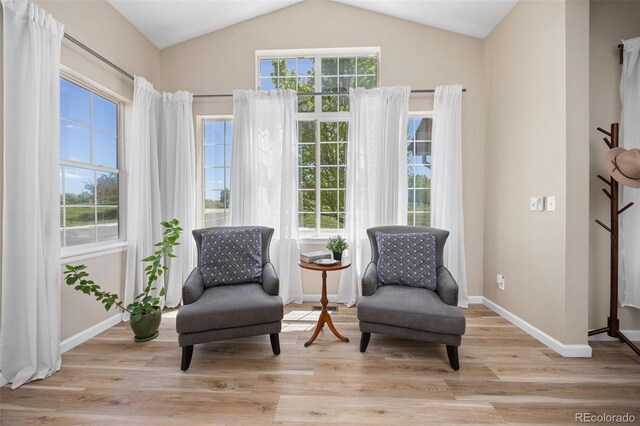 4467 Trailside Ln, Castle Rock, CO 80109 - sitting room featuring vaulted ceiling, baseboards, and light wood-style flooring
