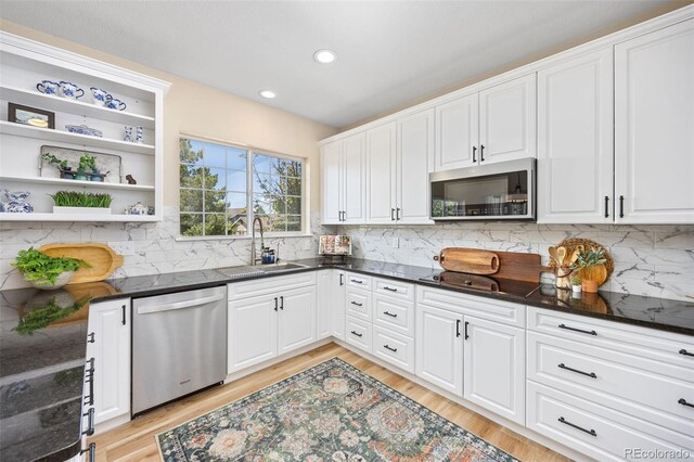 4467 Trailside Ln, Castle Rock, CO 80109 - kitchen featuring stainless steel appliances, a sink, open shelves, white cabinets, and recessed lighting