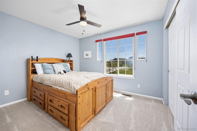 4467 Trailside Ln, Castle Rock, CO 80109 - bedroom featuring light colored carpet, baseboards, a closet, and a ceiling fan