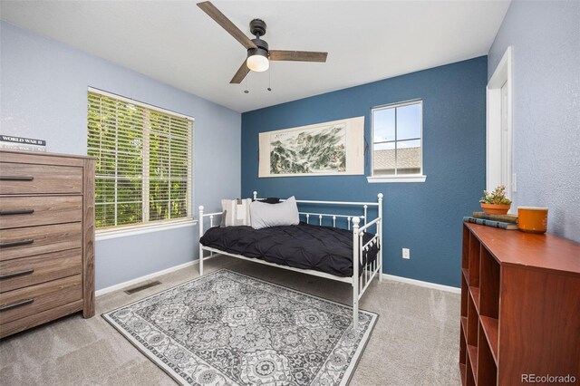4467 Trailside Ln, Castle Rock, CO 80109 - carpeted bedroom featuring multiple windows, baseboards, and ceiling fan