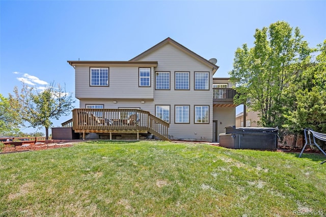 4467 Trailside Ln, Castle Rock, CO 80109 - back of property with a hot tub, a deck, and a yard