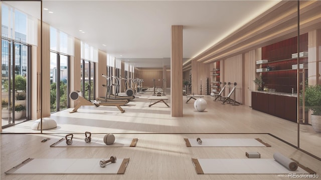 workout area featuring expansive windows