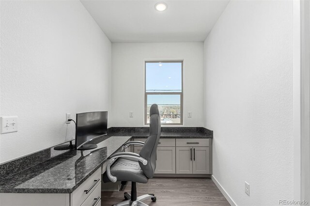 home office with light wood-style flooring