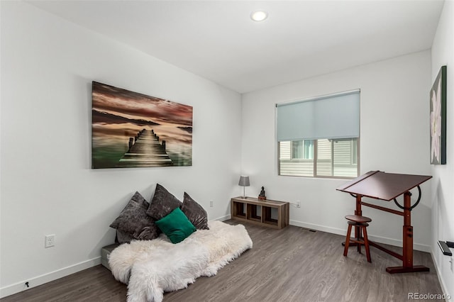 sitting room featuring wood finished floors, baseboards, and recessed lighting