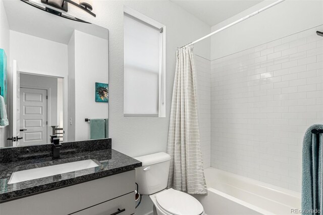 full bathroom with shower / bathtub combination with curtain, toilet, and vanity