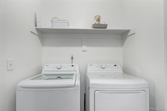 laundry room featuring washing machine and dryer