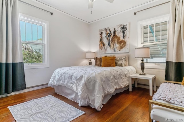 bedroom featuring ceiling fan and hardwood / wood-style flooring