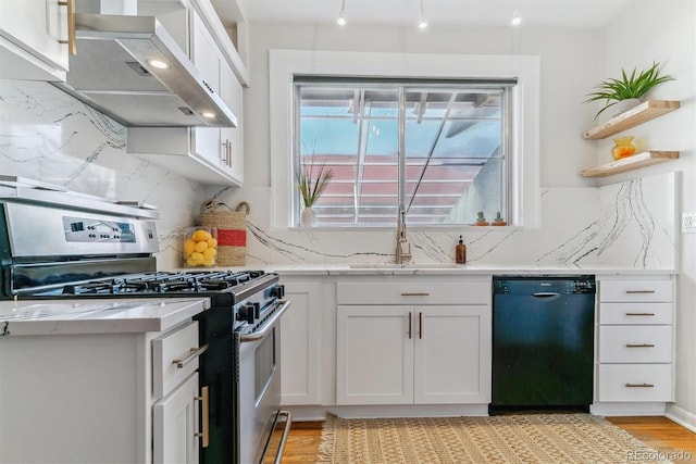 kitchen featuring black dishwasher, gas range, white cabinetry, and wall chimney range hood